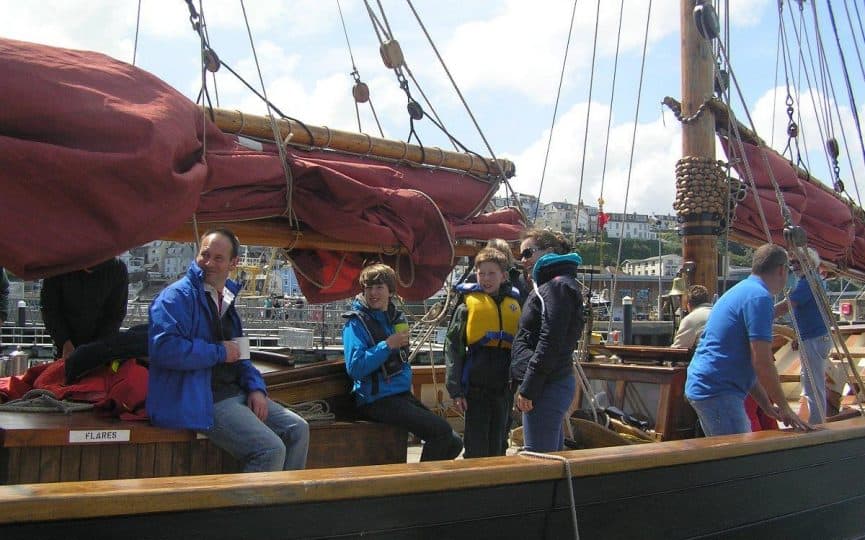 family sailing with classic sailing