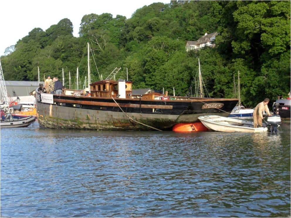 Pilgrim being towed to Ashley Butler's boat yard for restoration the River Dart. 