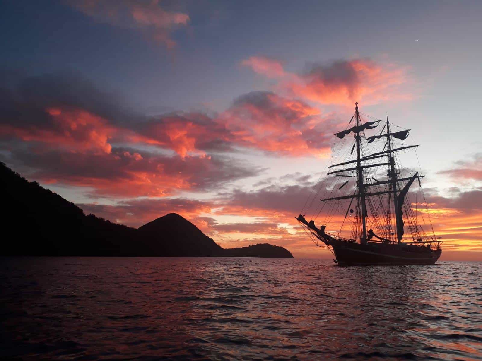 Tall ship Eye of the Wind at Anchor for sunset in Guadeloupe