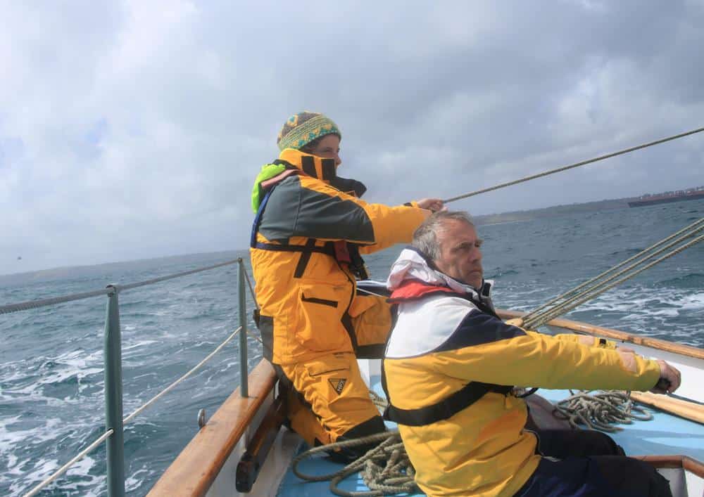 preparing to gybe by pulling the mainsheet in