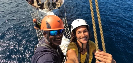 Santa Maria Manuela crew out on the bowsprit. experience a relaxed sailing adventure holiday aboard santa maria manuela with classic sailing.