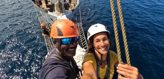 Santa Maria Manuela crew out on the bowsprit. experience a relaxed sailing adventure holiday aboard santa maria manuela with classic sailing.