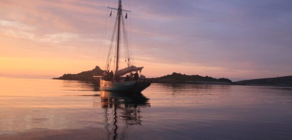 Ocean sunset after a long midsummer day in the isles of scilly on sailing boat Tallulah